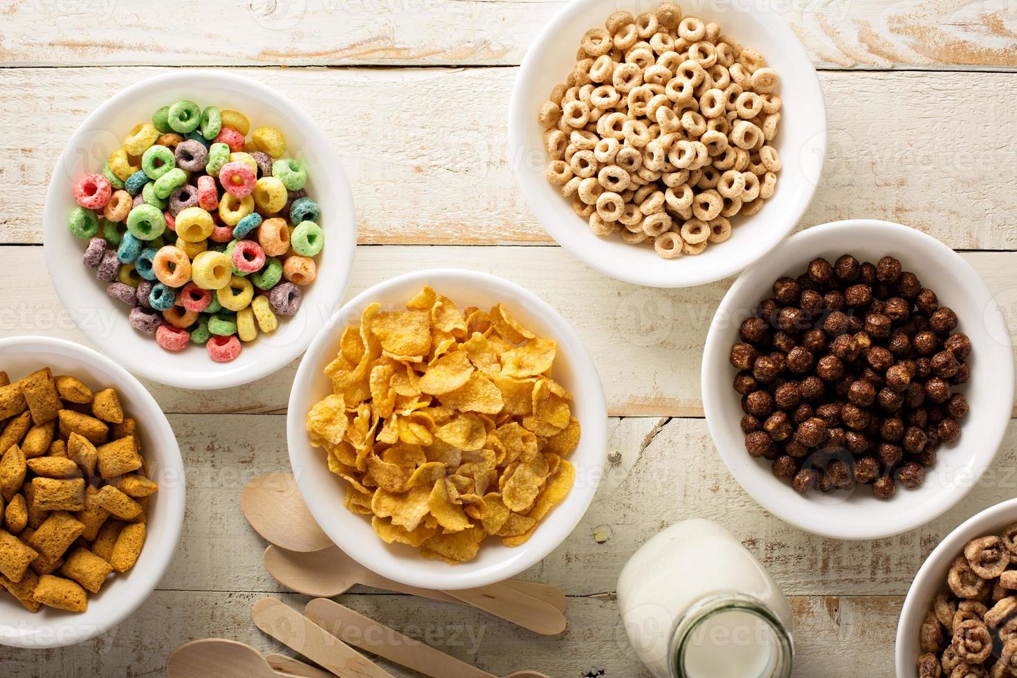 Variety of cold cereals in white bowls photo