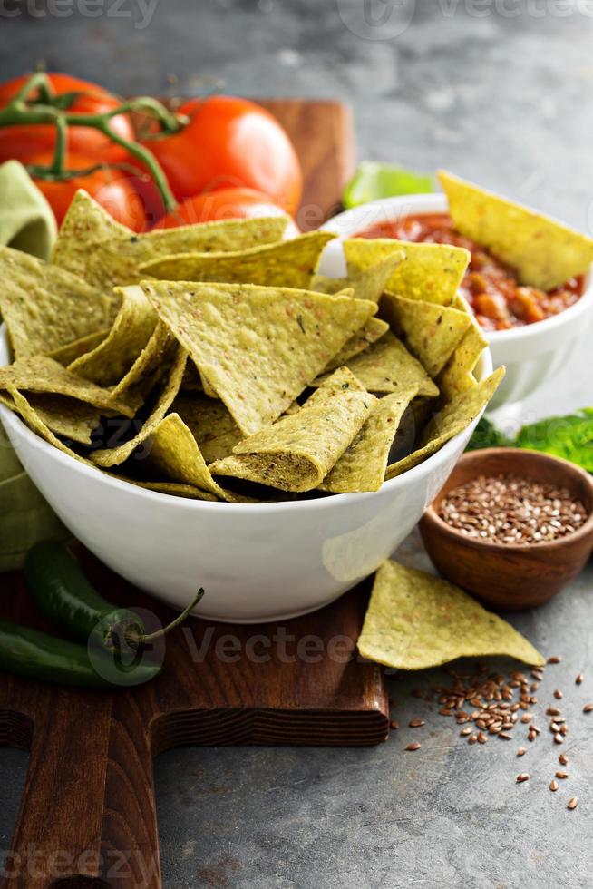 Healthy corn tortilla chips with spinach and flax seeds photo