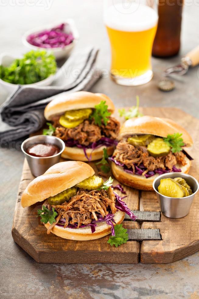 Pulled pork sandwiches with cabbage and pickles photo