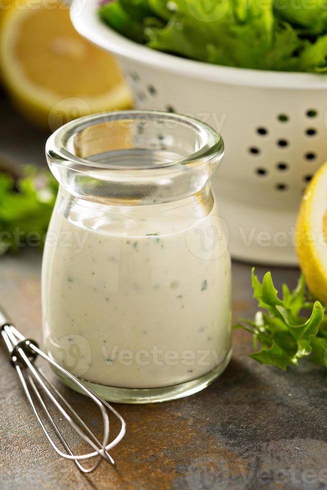 Homemade lemon ranch dressing in a small jar photo