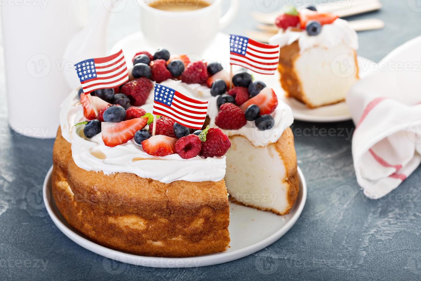 Angel food cake with cream and berries photo