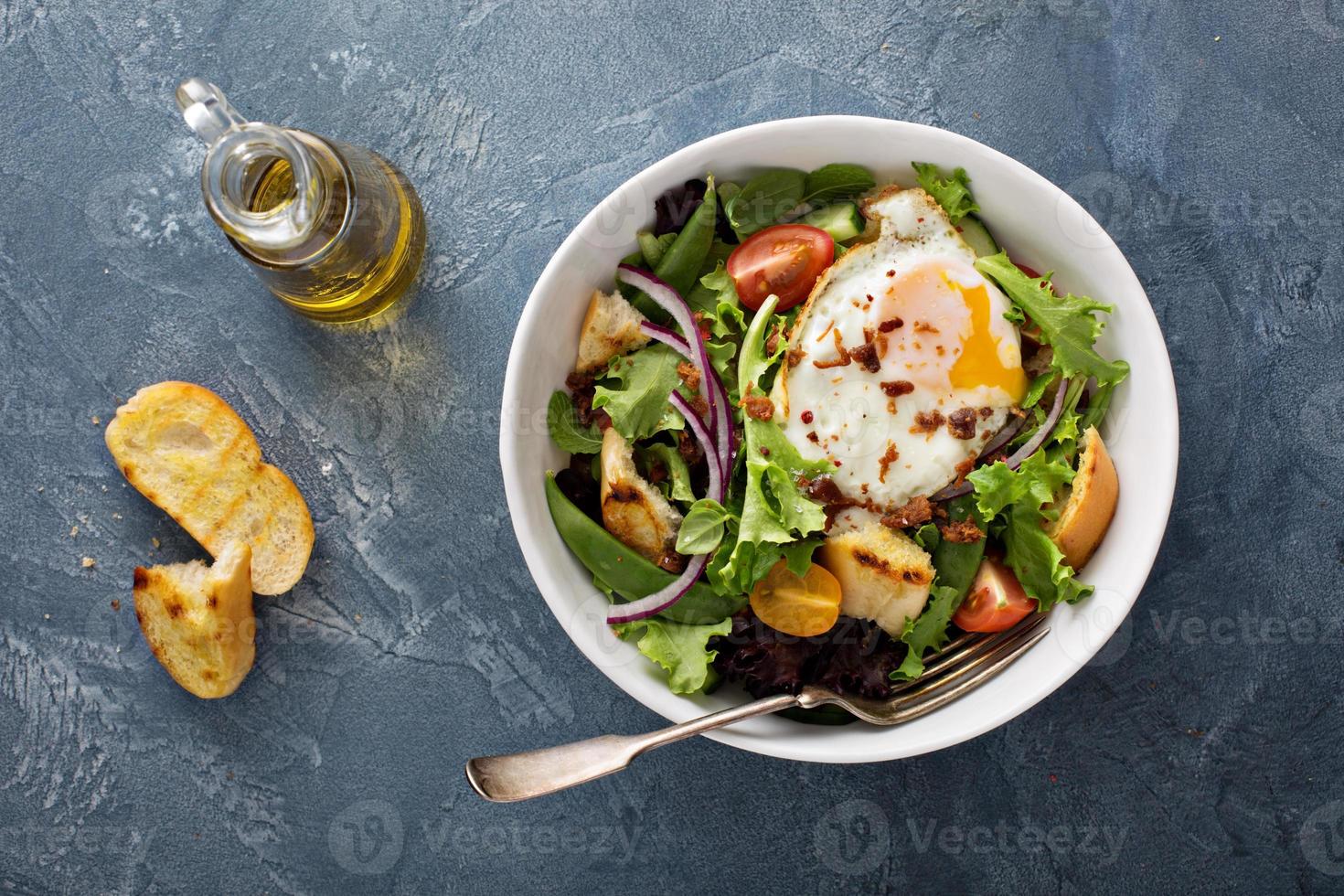 Breakfast salad with eggs and bacon photo