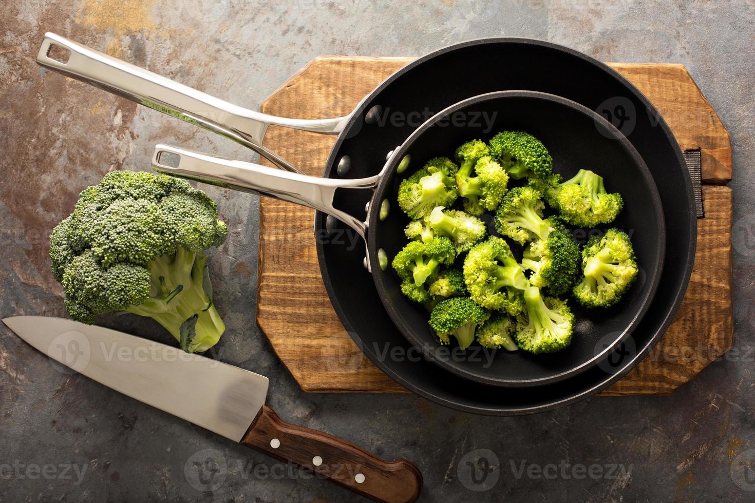 Steamed or stewed broccoli in a skillet photo