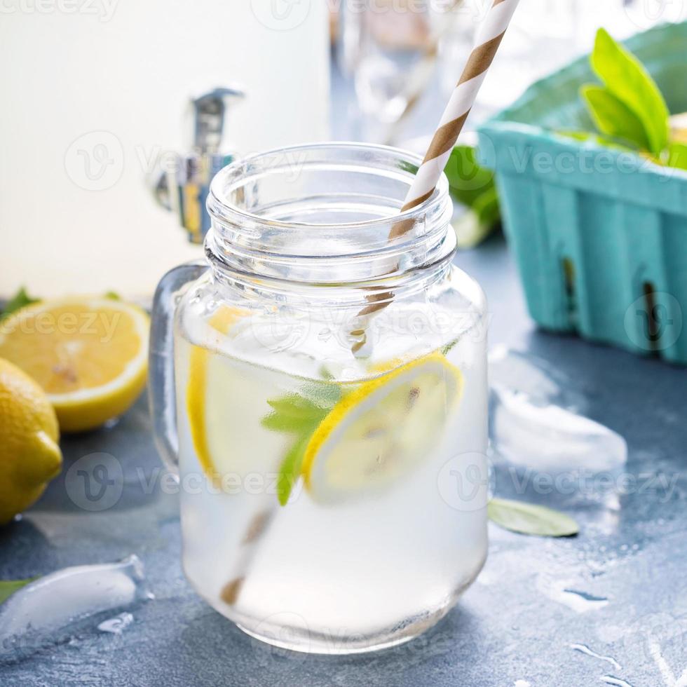 Fresh citrus lemonade in beverage dispenser photo