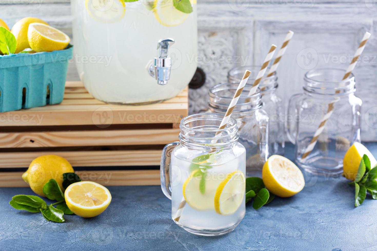 Fresh citrus lemonade in beverage dispenser photo