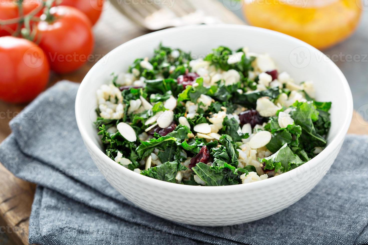 Warm kale salad with brown rice and cranberry photo