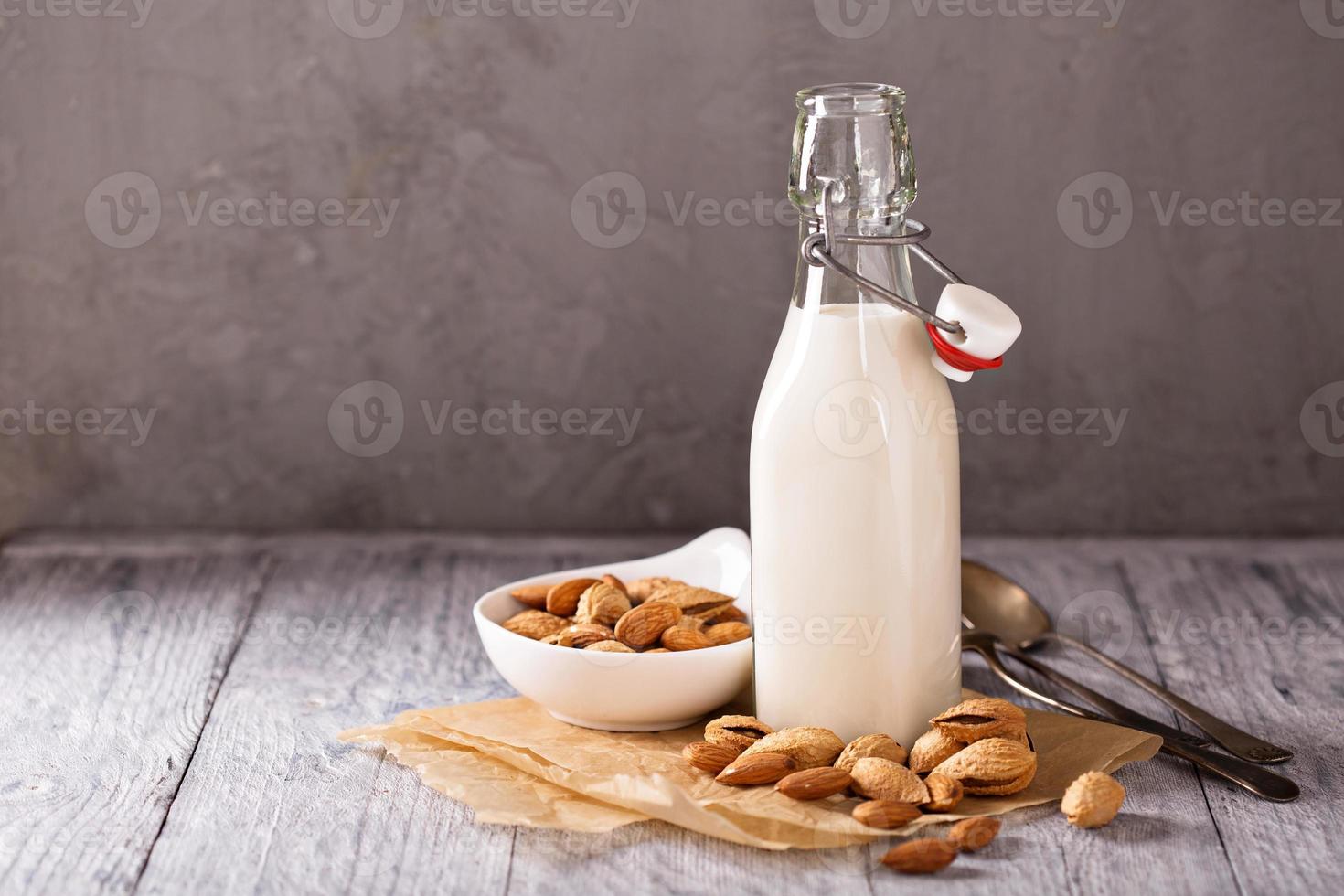 Homemade almond milk in a bottle photo