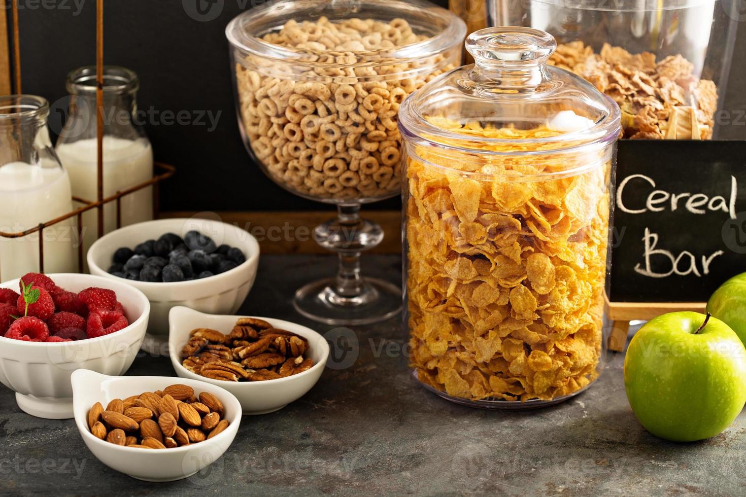 Cereal bar or buffet wih cornflakes, fruit and nuts photo