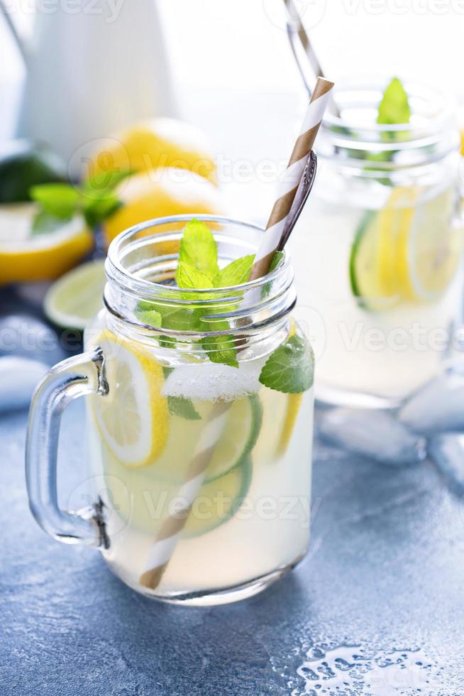 Fresh citrus lemonade in mason jars photo