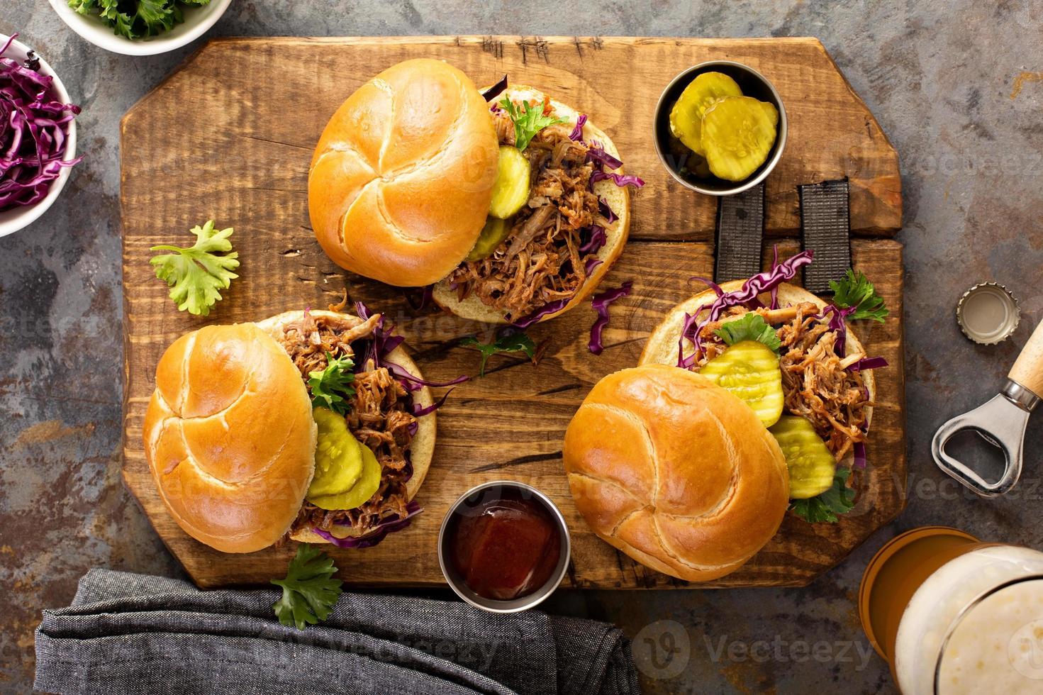 Pulled pork sandwiches with cabbage and pickles photo