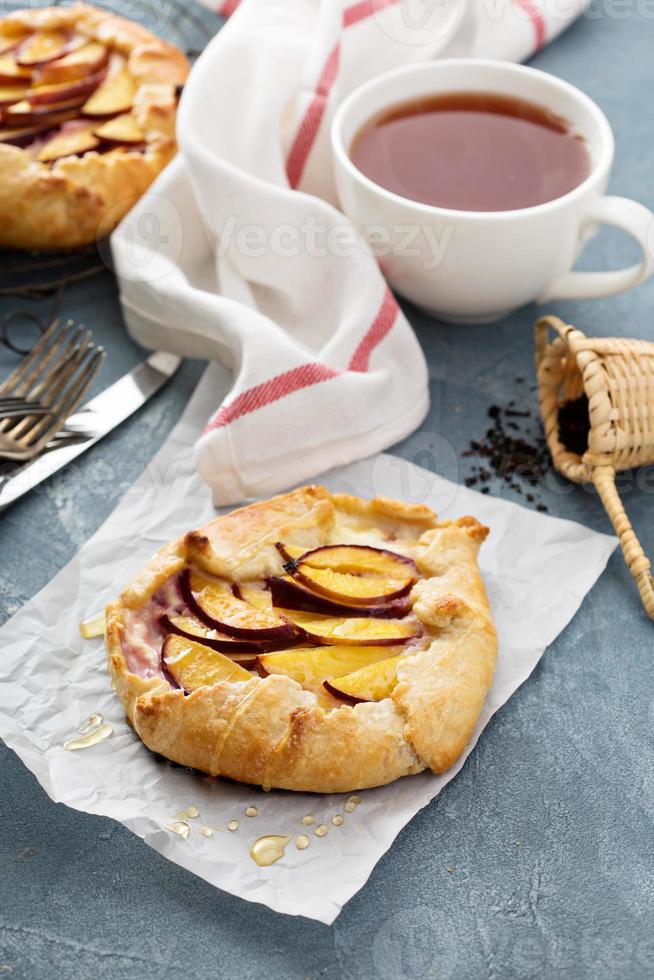 Open pie with plums photo