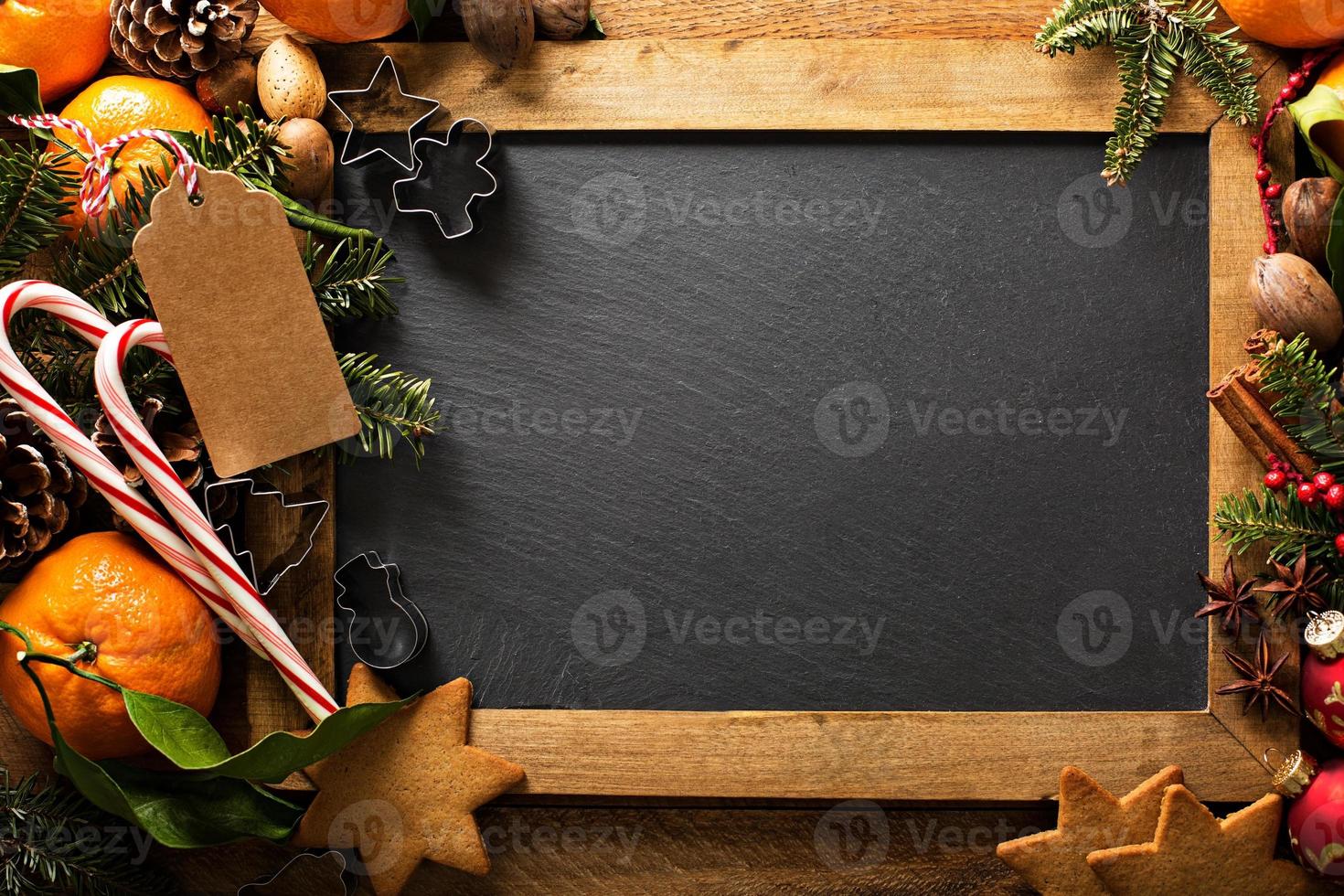 Christmas background with oranges, candy canes and decorations photo