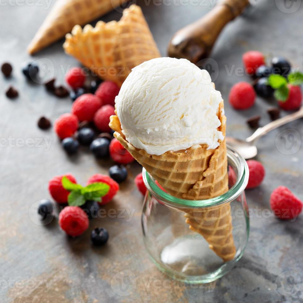 Vanilla ice cream scoop in a waffle cone photo