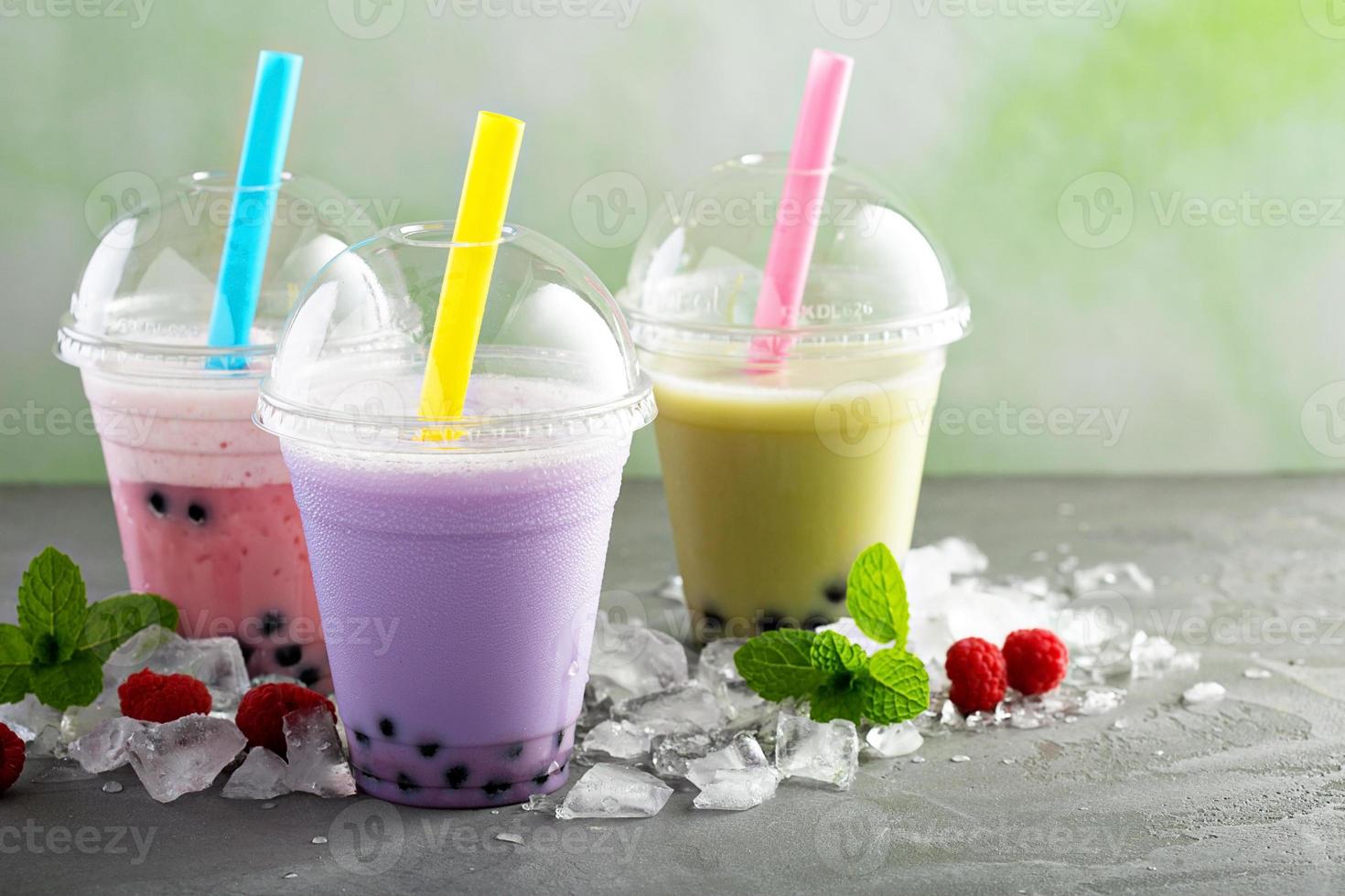 Variety of bubble tea in plastic cups photo