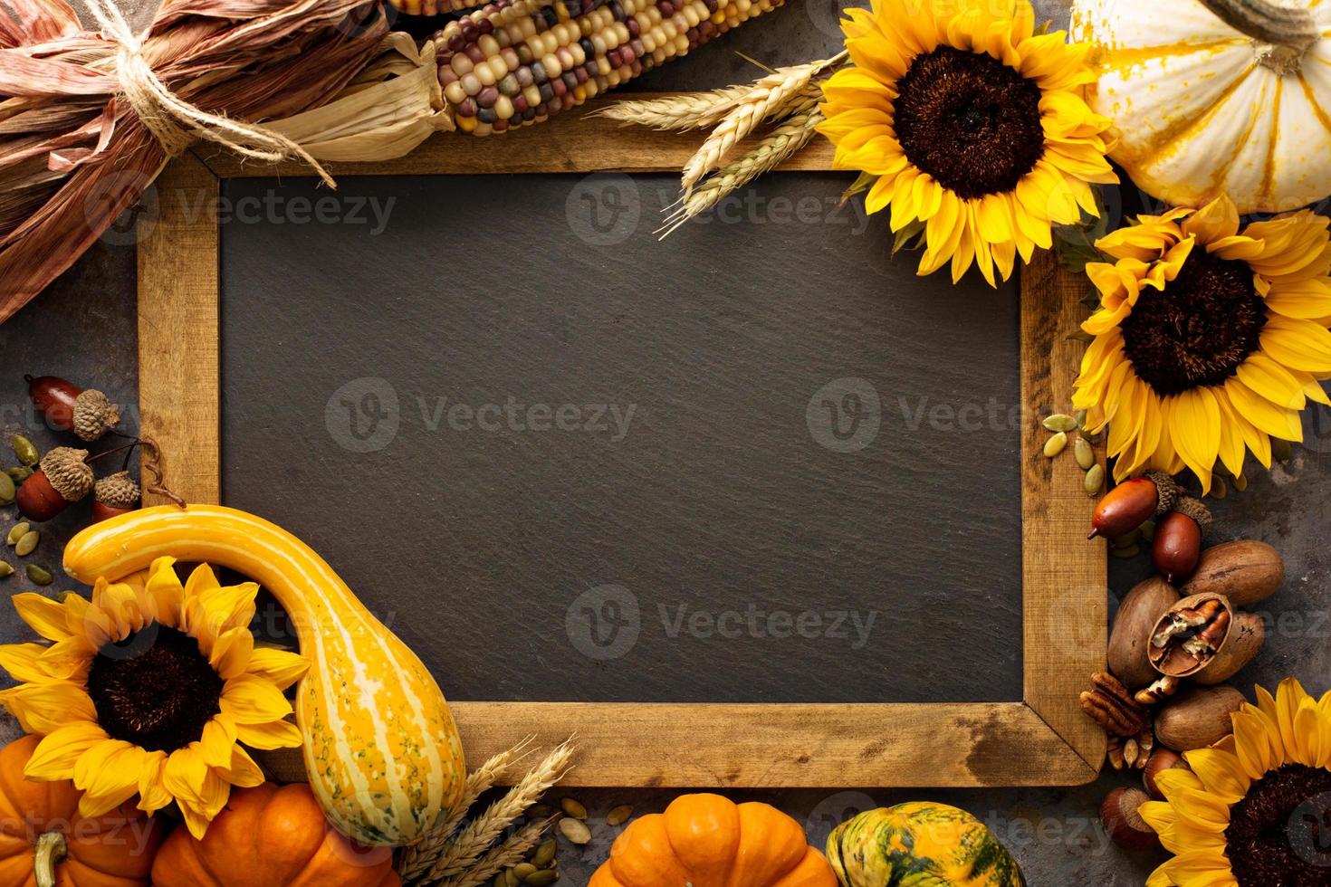 Fall chalkboard frame with pumpkins photo