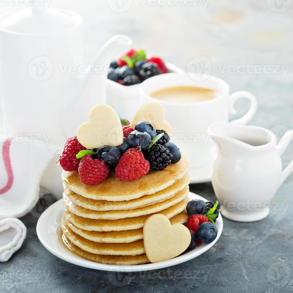 Stack of buttermilk pancakes with fresh berries photo