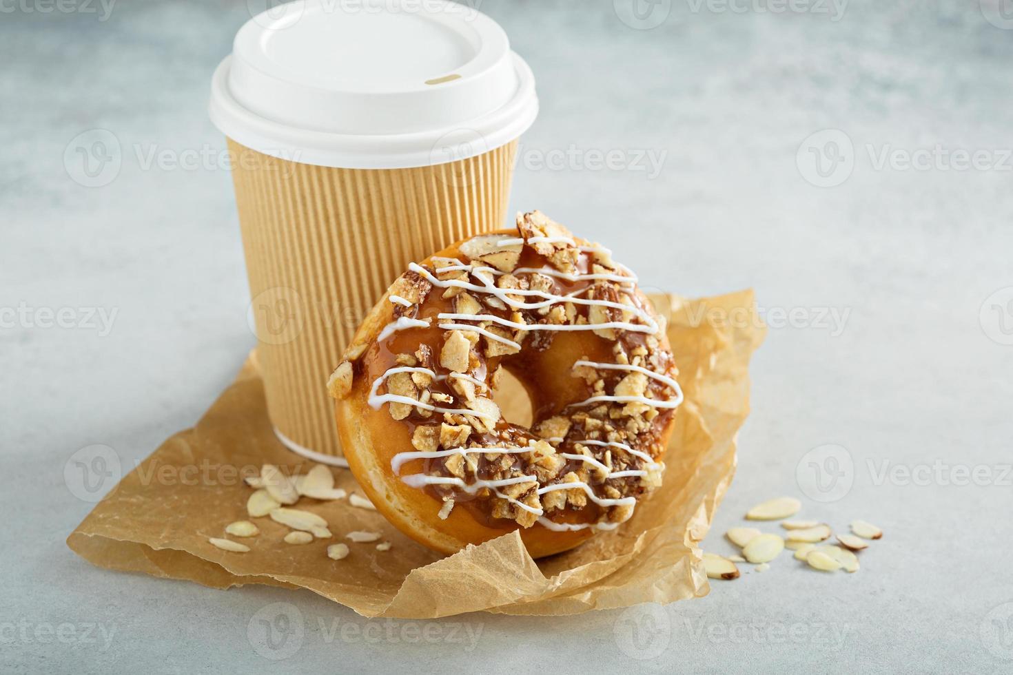 Almond and caramel glazed donut with cherry photo