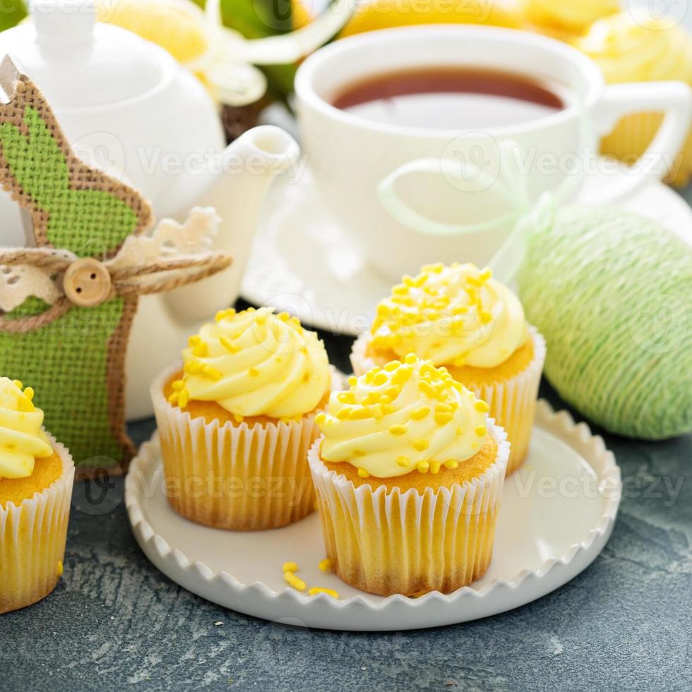Lemon cupcakes with yellow frosting photo