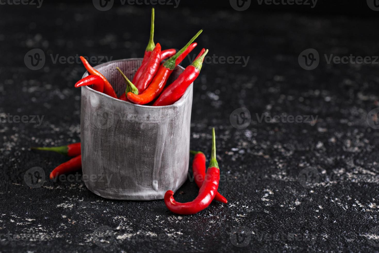 Red chili peppers in a cup photo