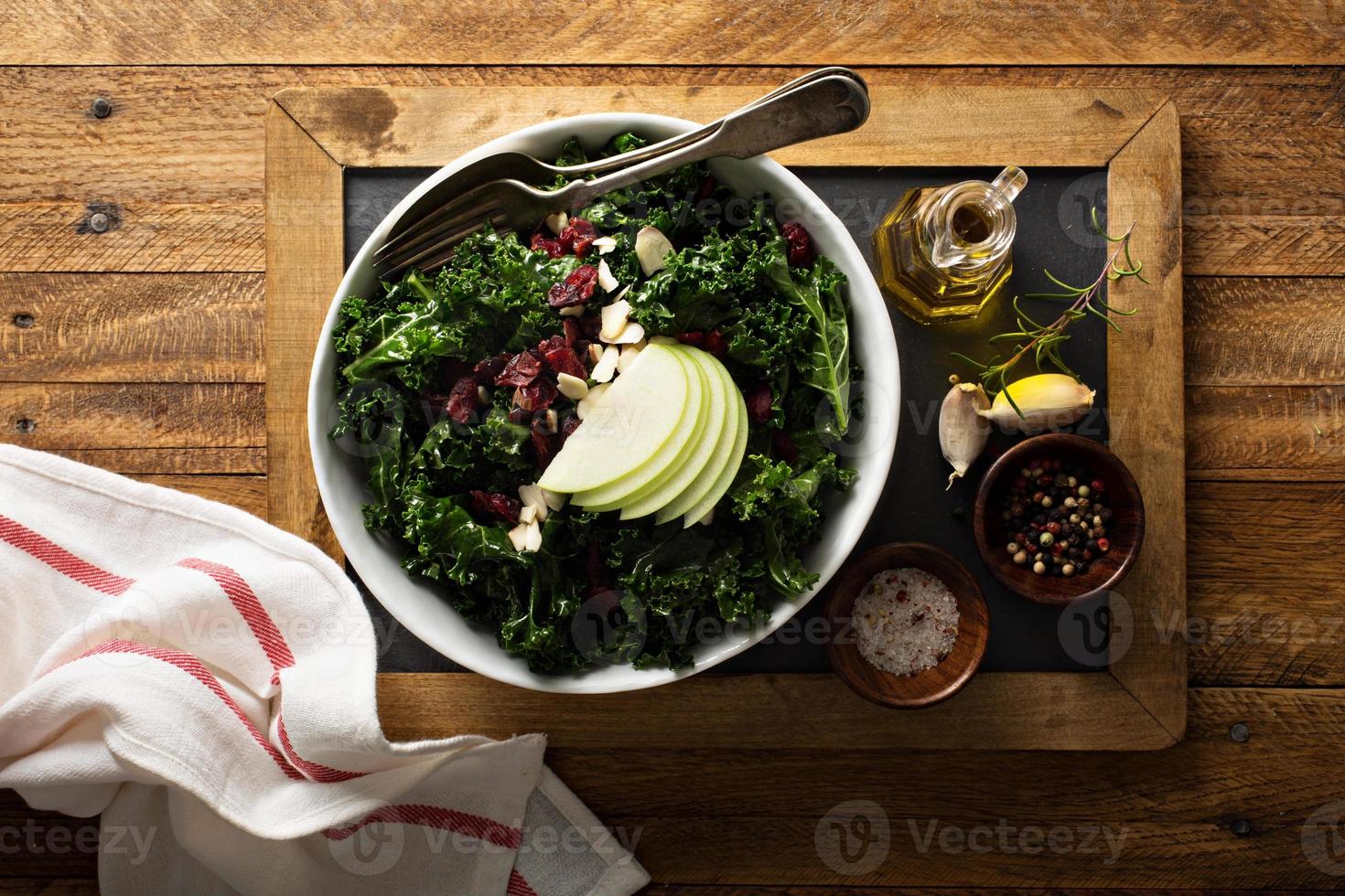 Kale salad with dried cranberry and apple photo