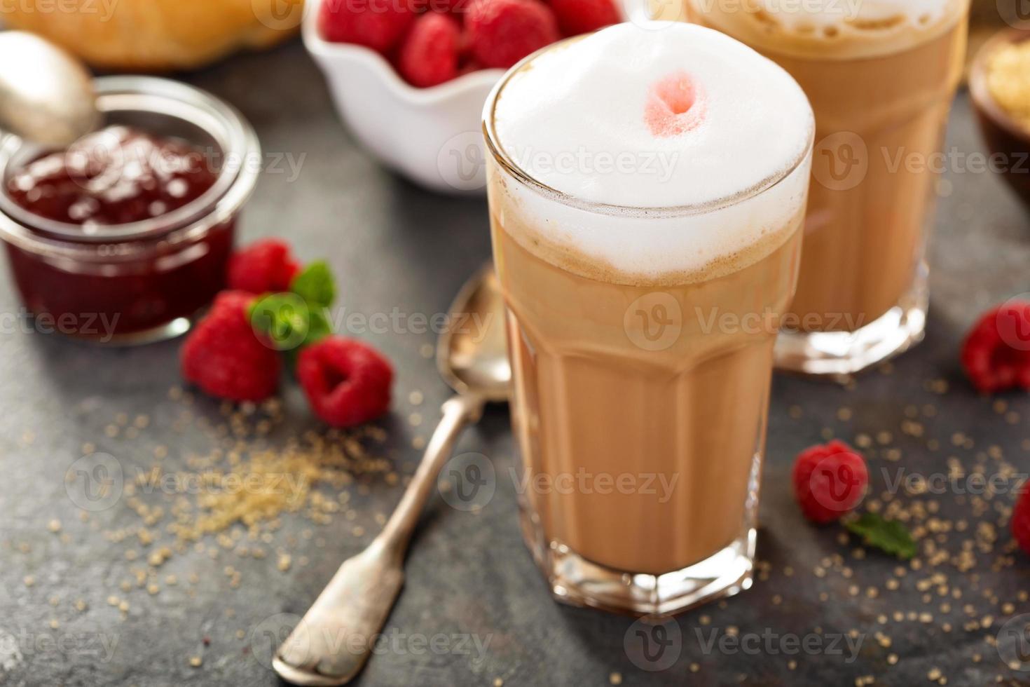 Hot coffee latte with raspberry syrup photo