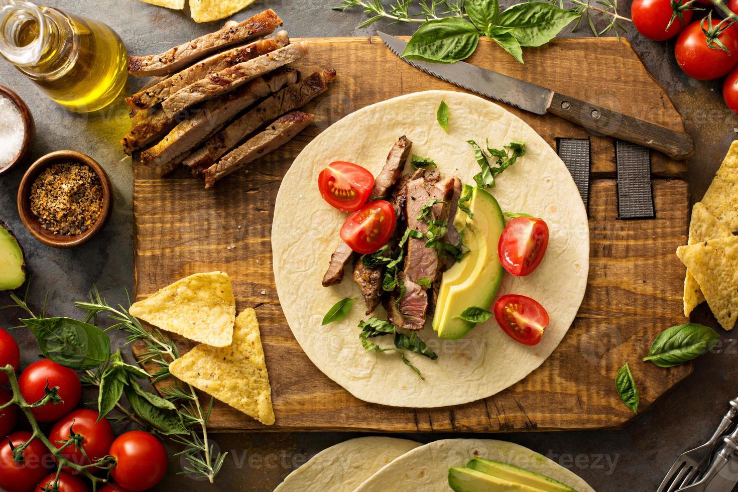 Making tacos with grilled steak photo