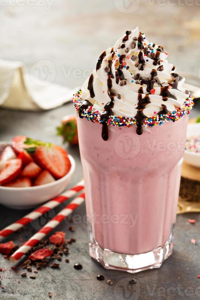 Strawberry milkshake with whipped cream photo