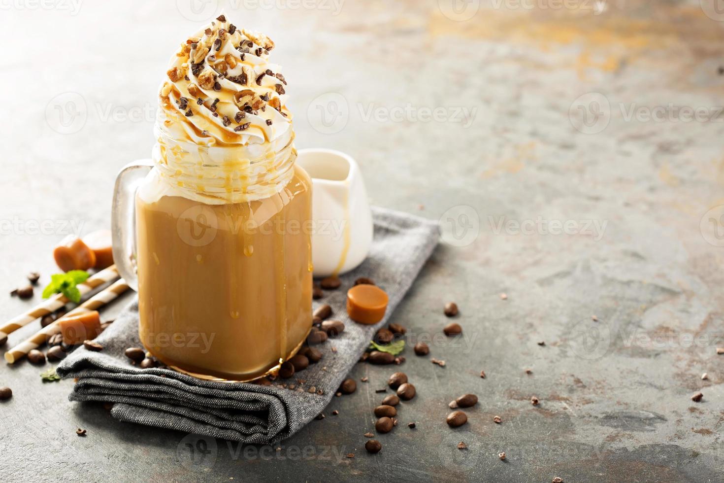 Caramel iced latte with whipped cream photo