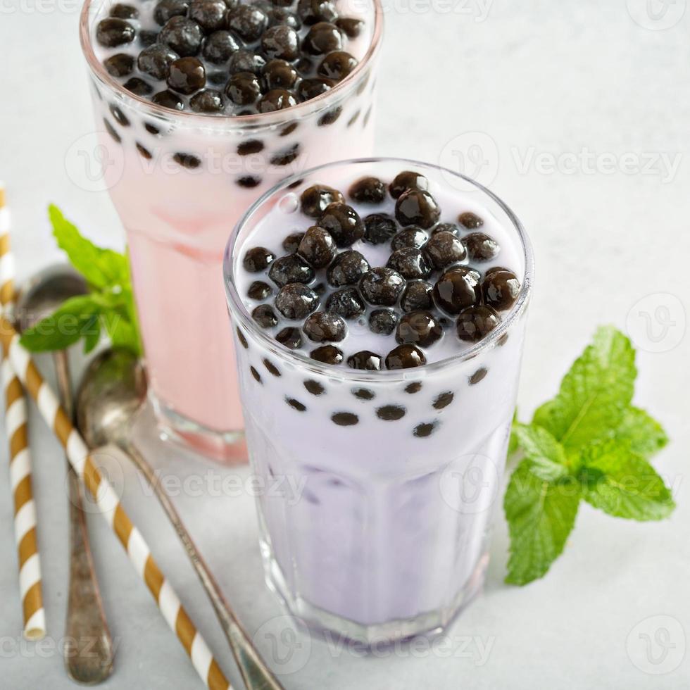 Taro and strawberry milk bubble tea in tall glasses photo