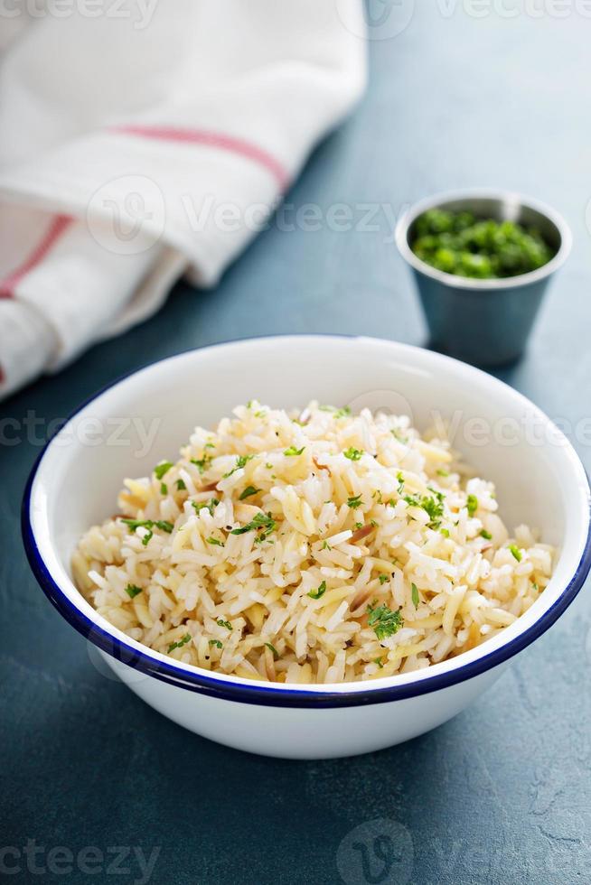 Rice pilaf in a white bowl photo