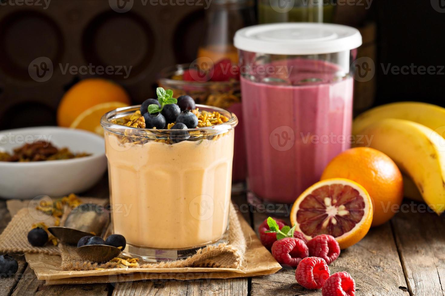 Orange mango smoothie with granola photo