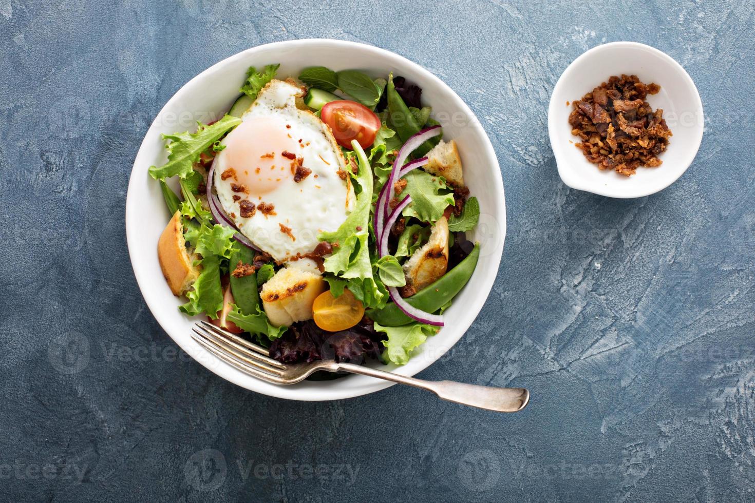 Breakfast salad with eggs and bacon photo