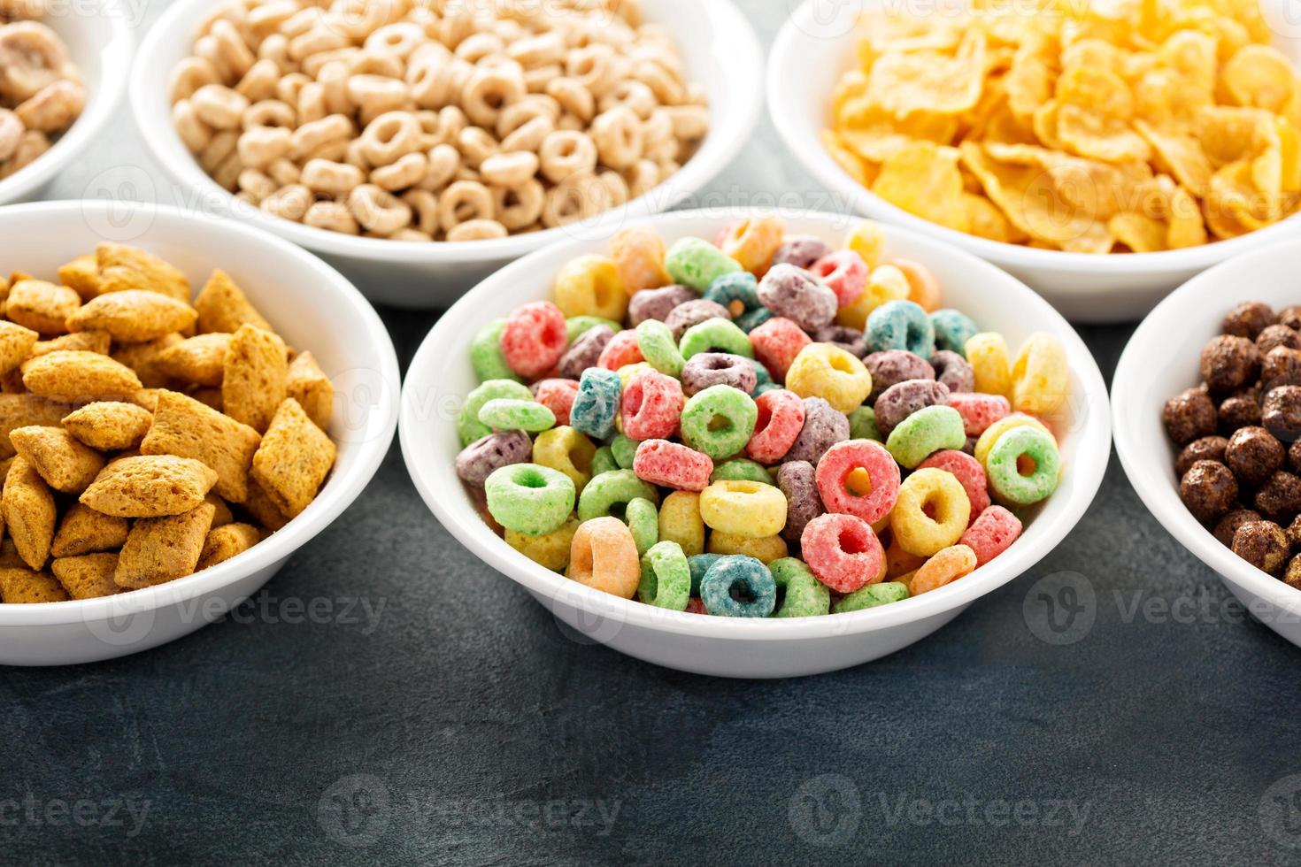 Variety of cold cereals in white bowls photo