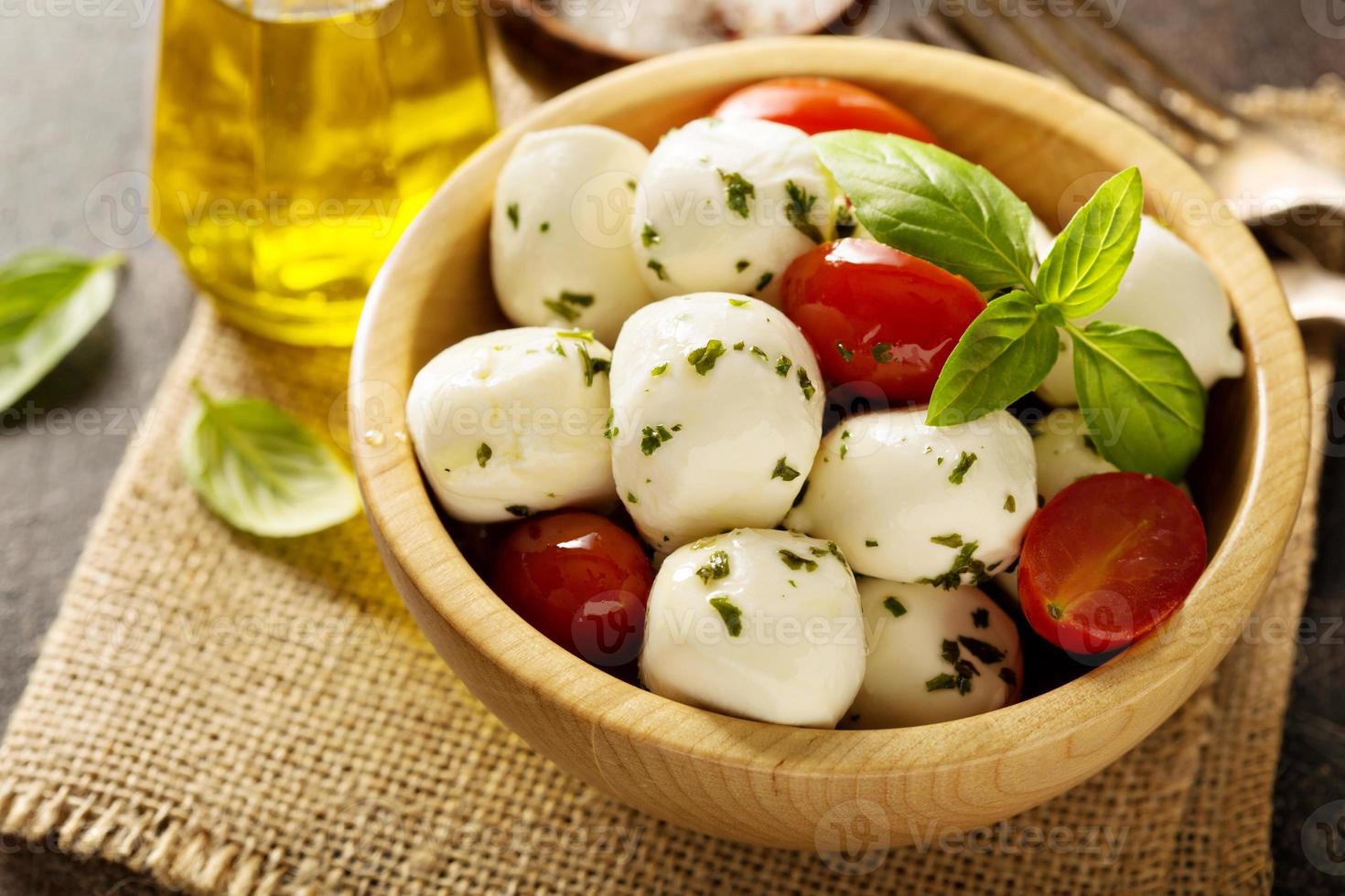 Fresh mozzarella marinated with herbs photo