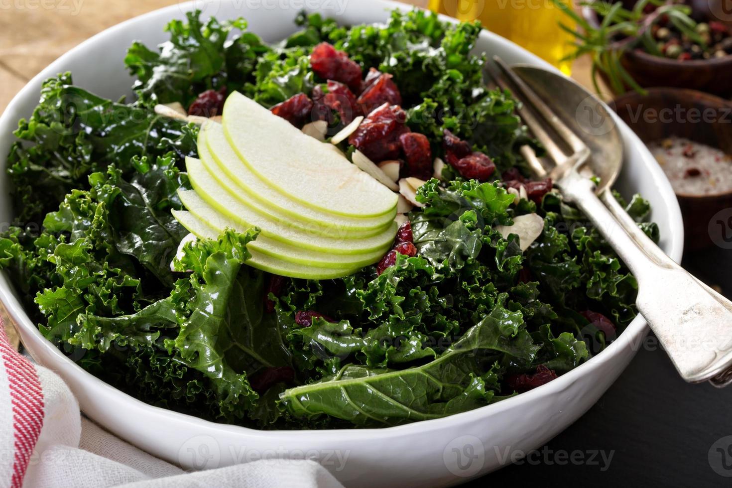 Kale salad with dried cranberry and apple photo