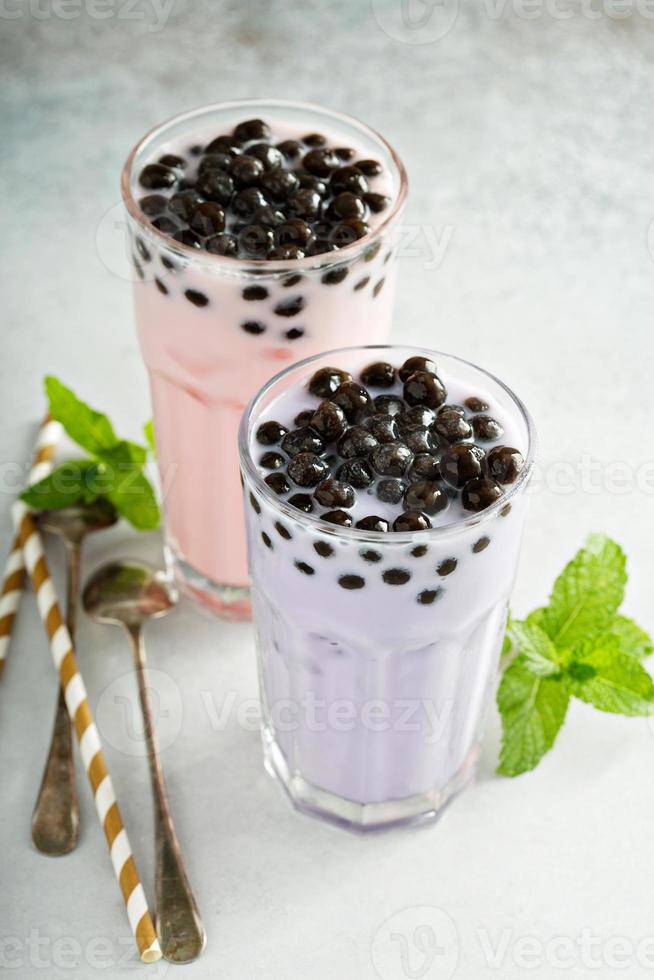 Taro and strawberry milk bubble tea in tall glasses photo