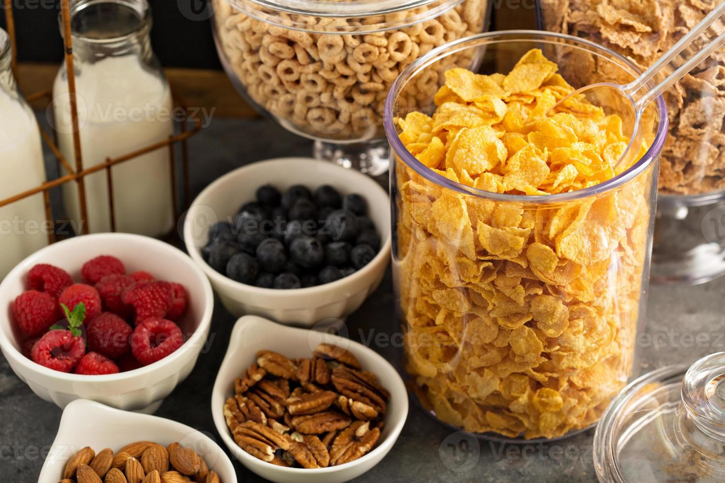Cereal bar or buffet wih cornflakes, fruit and nuts photo
