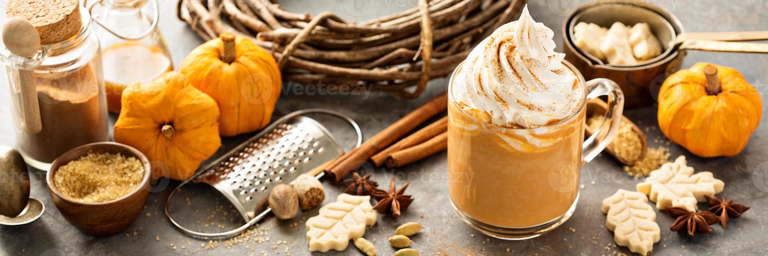 Pumpkin spice latte in a glass mug photo