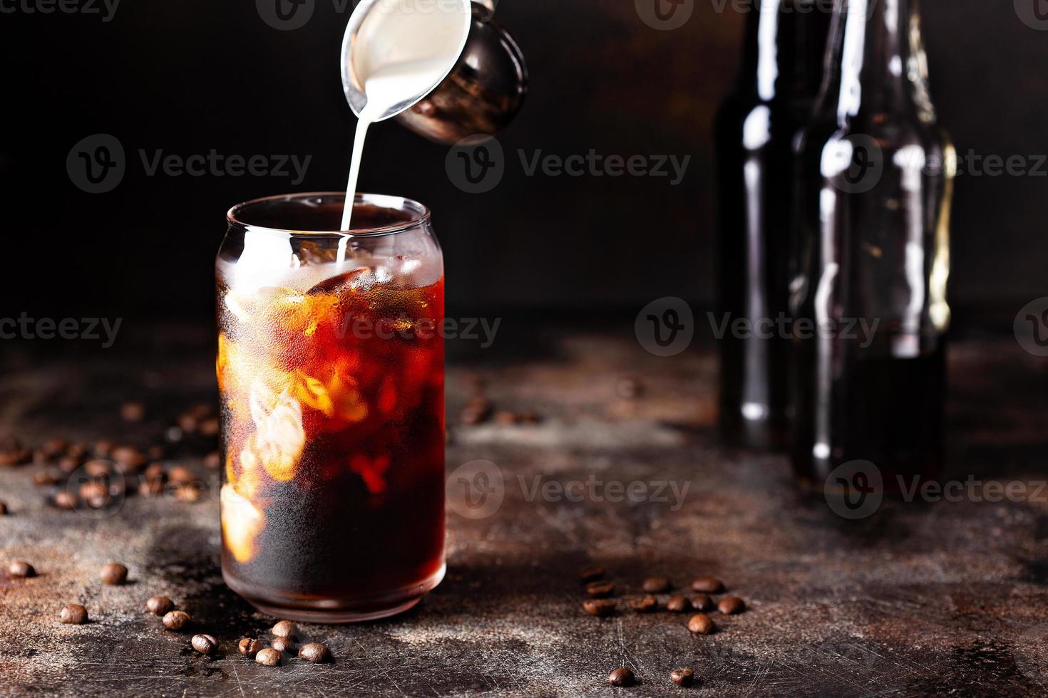 Cold brew iced coffee in glass bottles photo