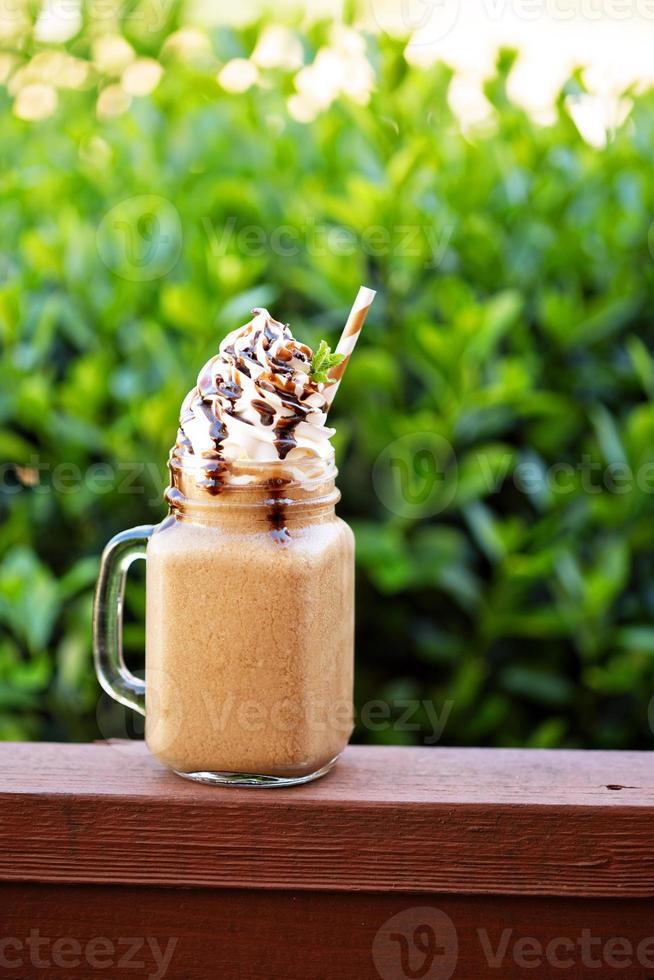 Chocolate frappe coffee with whipped cream outside photo