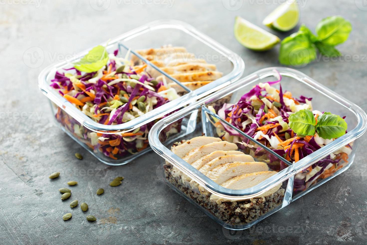 Healthy meal prep containers with quinoa and chicken photo