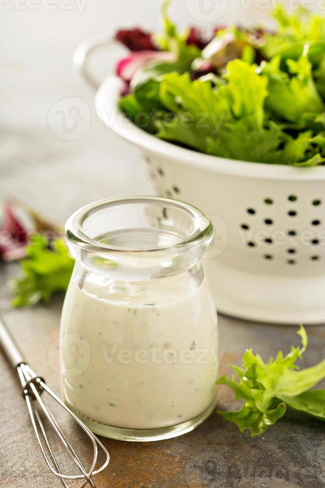 Homemade ranch dressing in a small jar photo