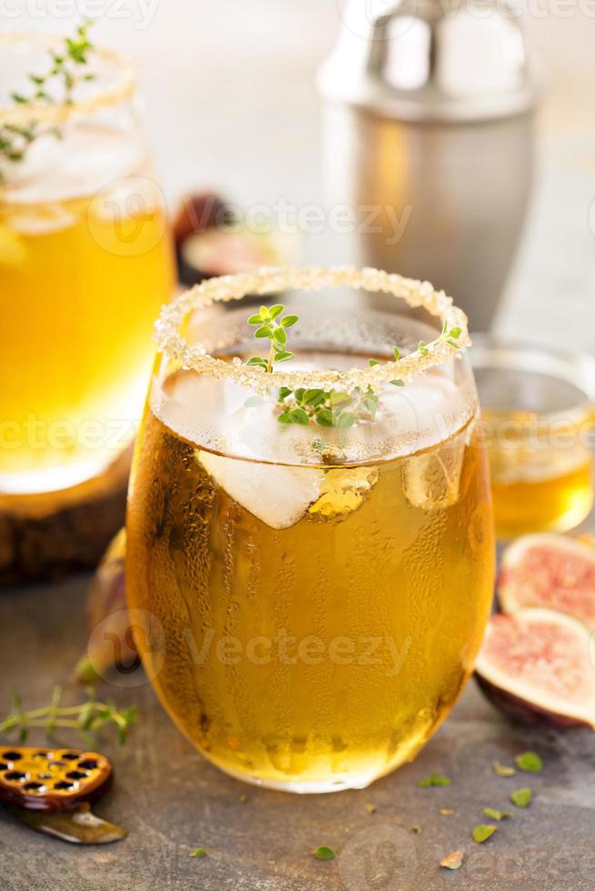 Fall refreshing cocktail with fig, honey and thyme photo