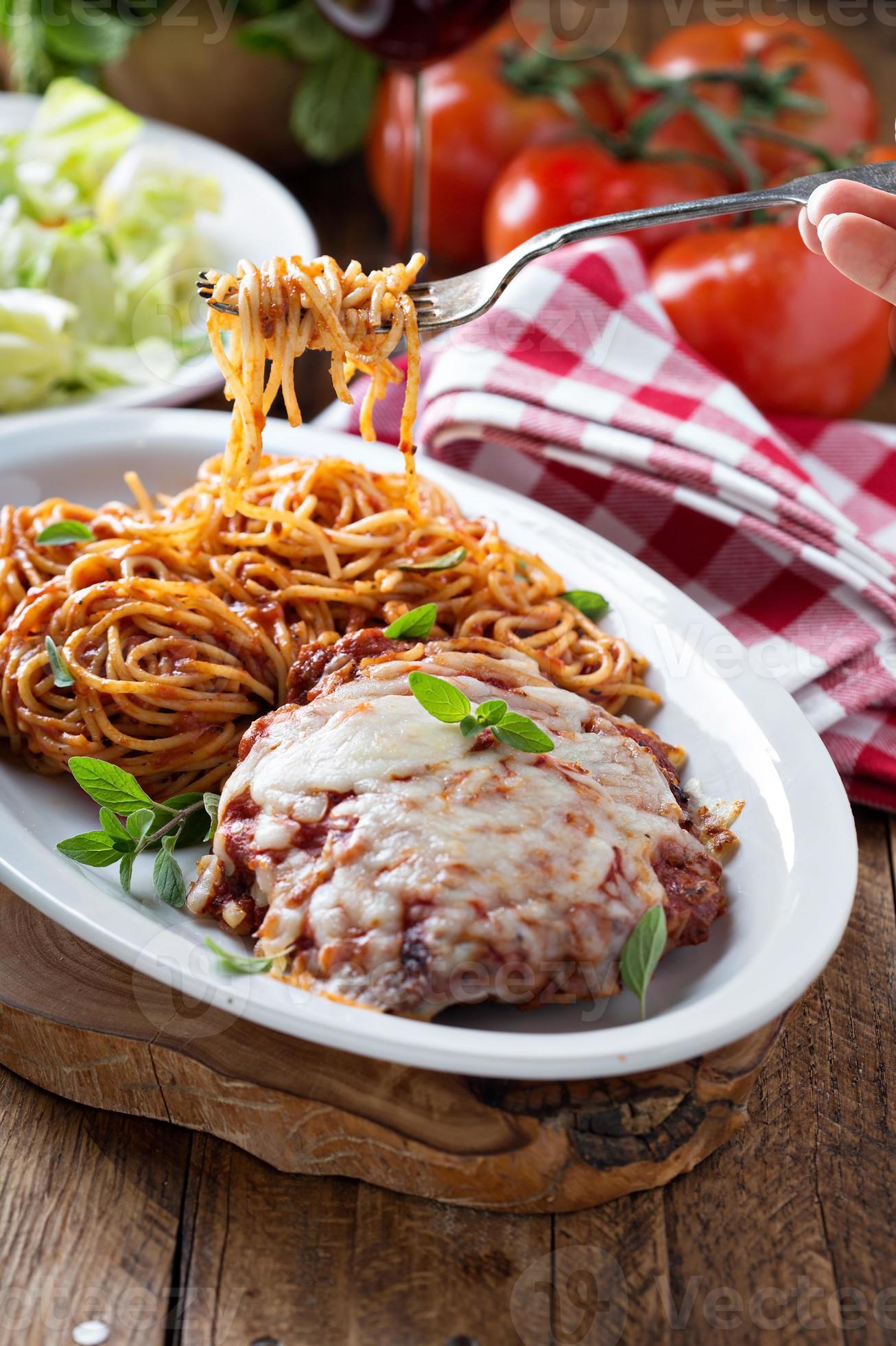 Veal Parmigiana with spaghetti 15760054 Stock Photo at Vecteezy