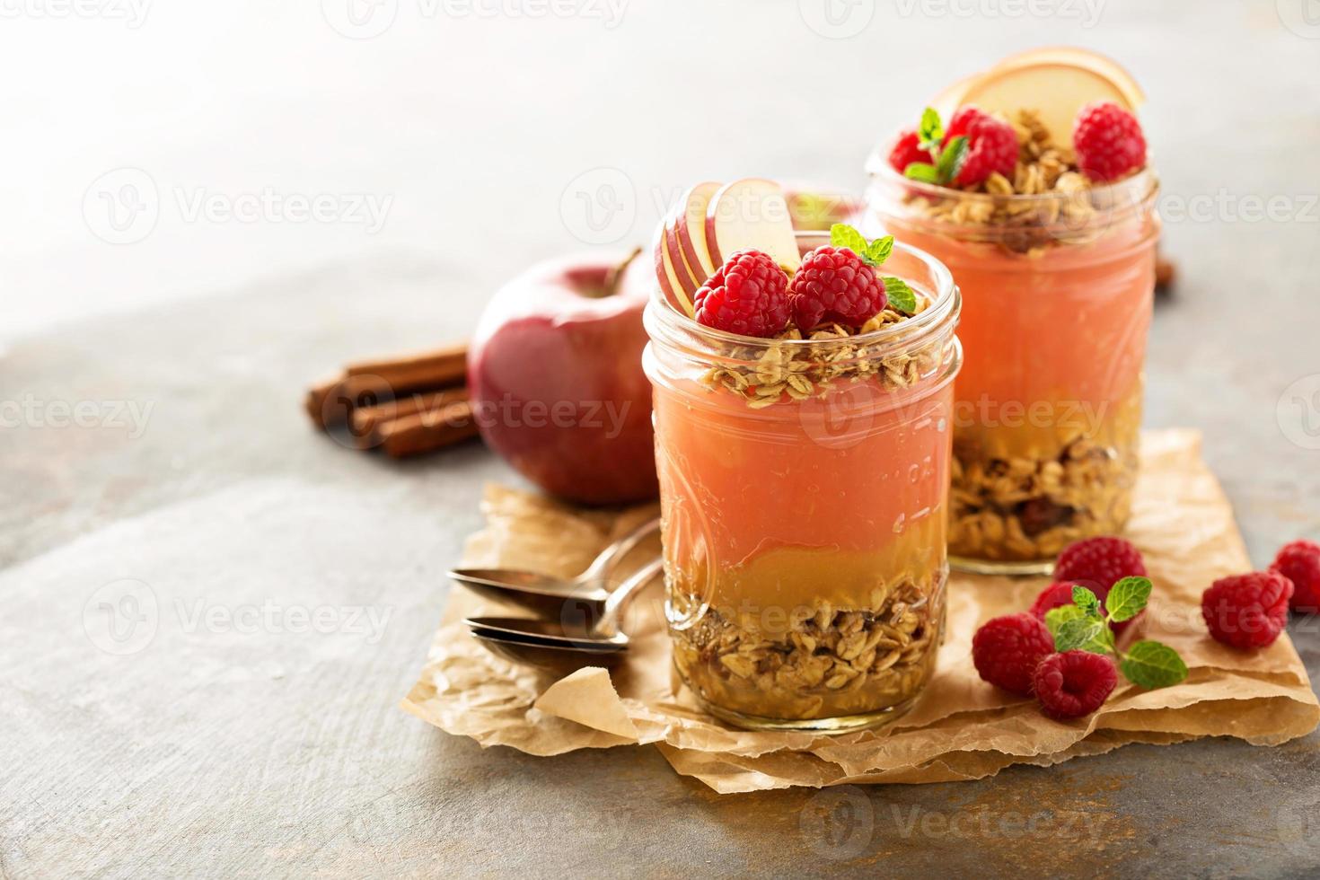 Applesauce and raspberry puree parfait with granola photo