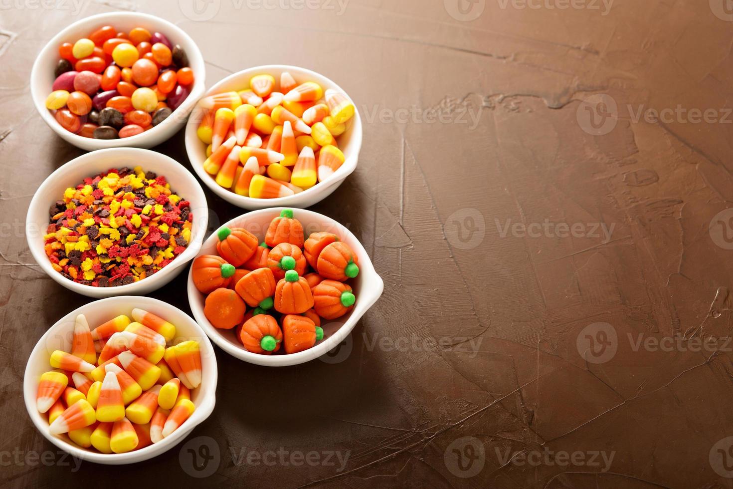 Halloween candy in little white bowls photo