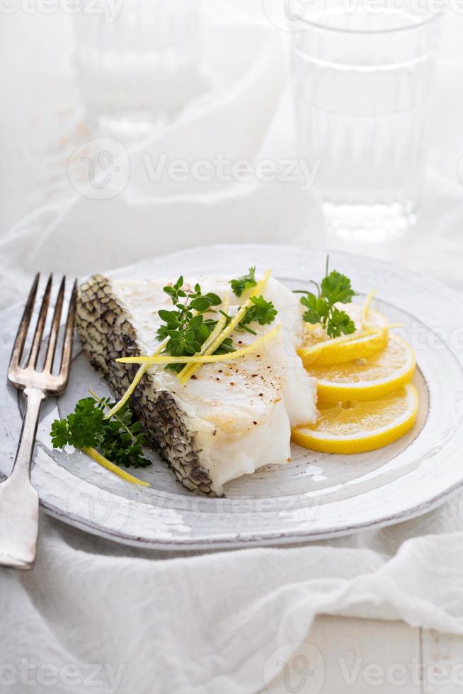 Grilled stripped bass with lemon and herbs photo