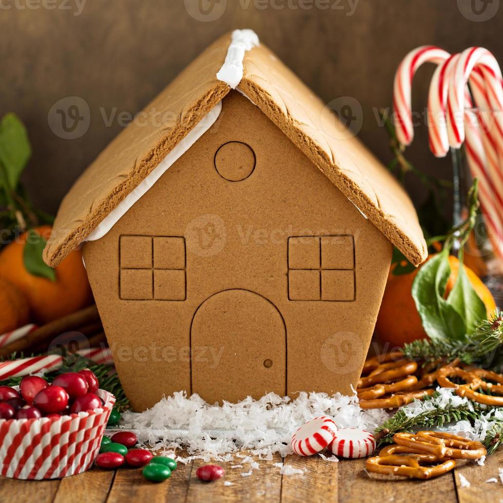 Gingerbead house ready to be decorated with candy photo