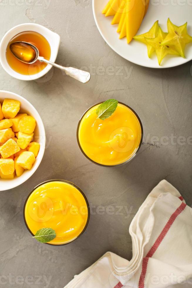 Mango smoothie with honey and coconut photo