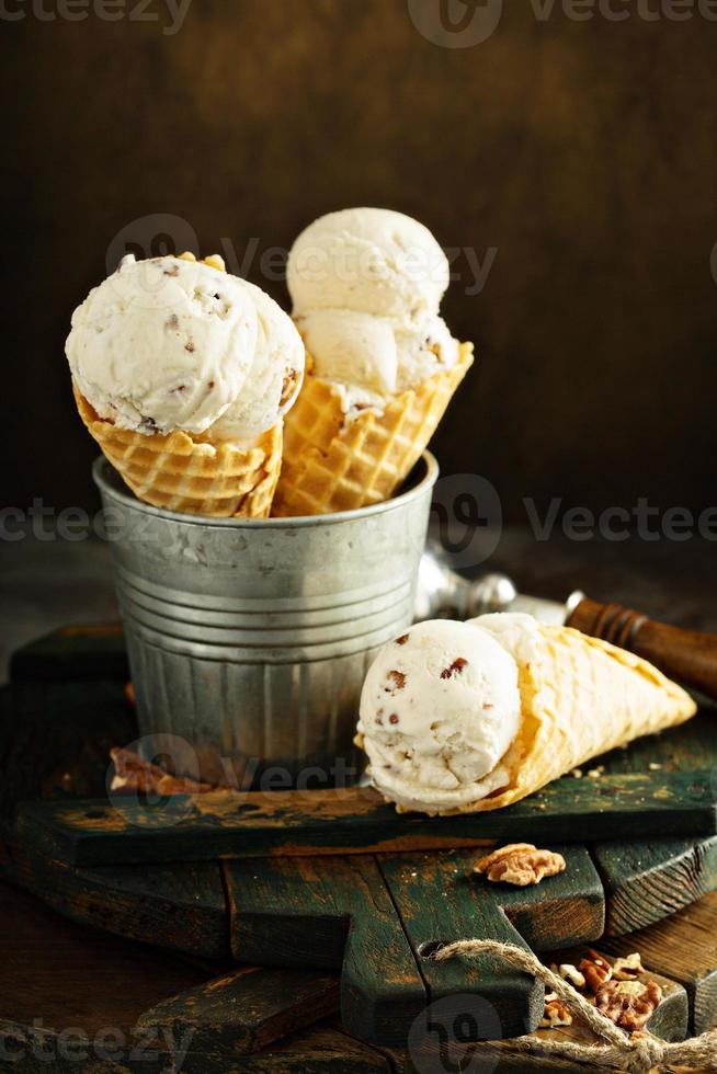 Butter pecan ice cream in waffle cones photo